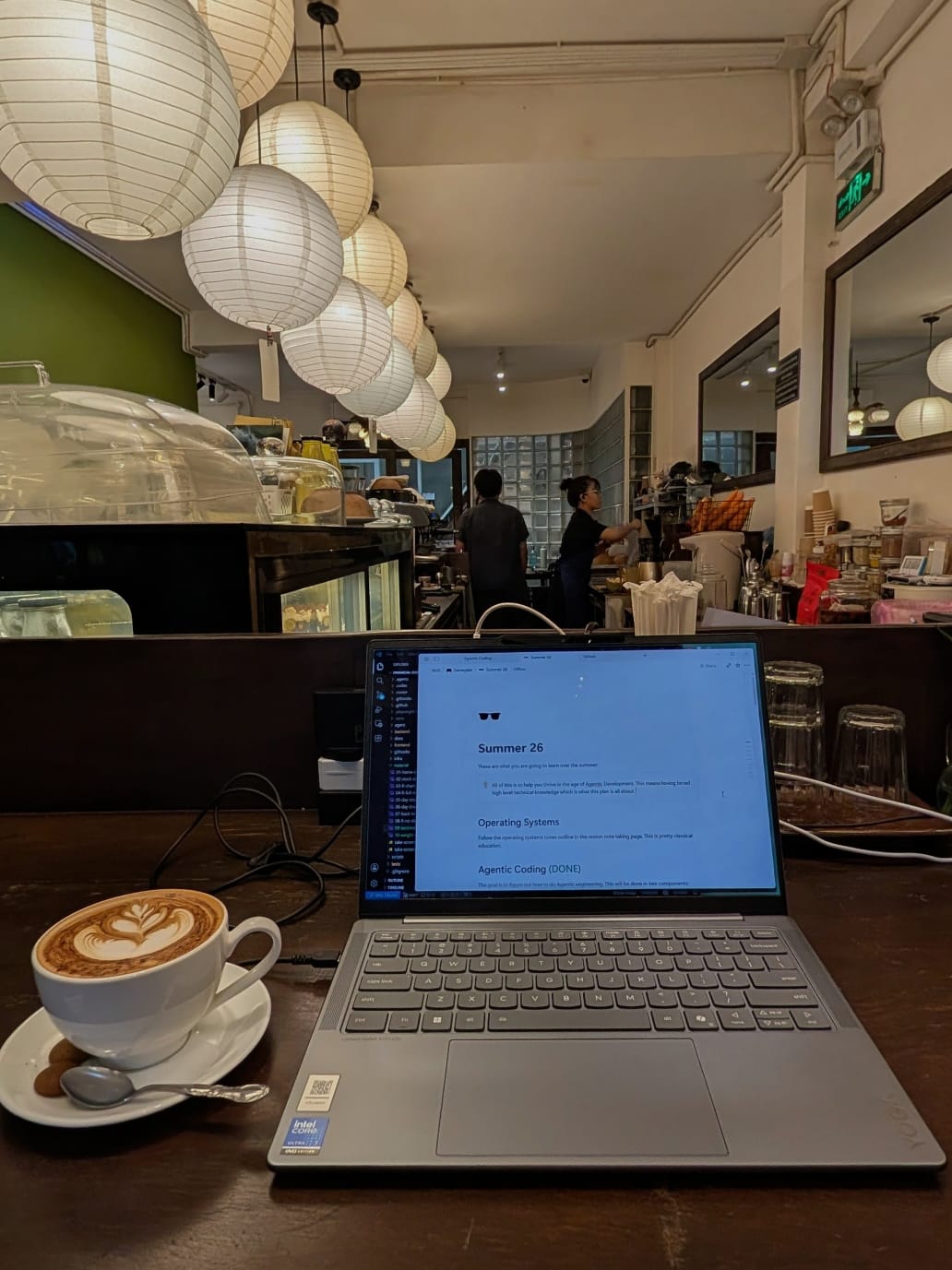 Notebook, laptop, and technical notes introducing Praneeth's CS Field Notes.